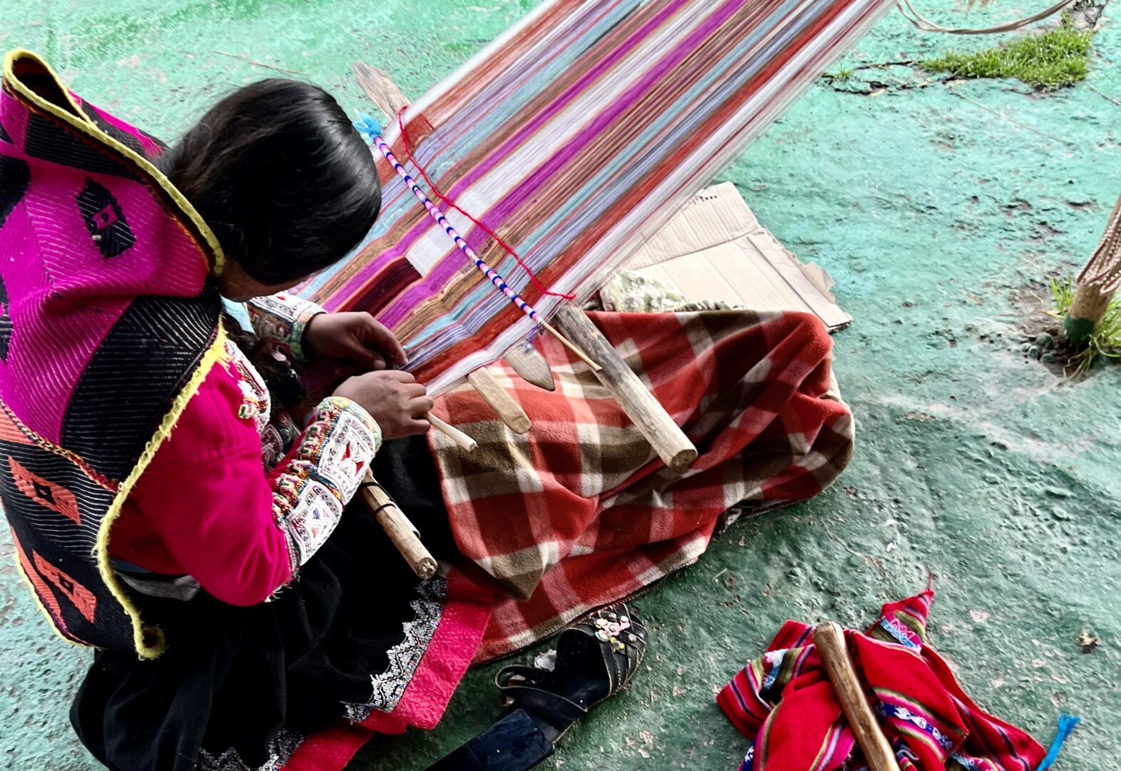 Peru girl weaving color fabrics